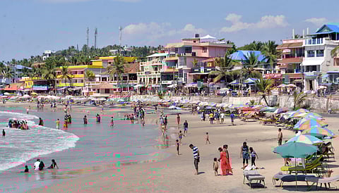 A scene from the crowded Kovalam beach with tourists braving the  scorching heat of the afternoon. (Photo | Vincent Pulickal, EPS)