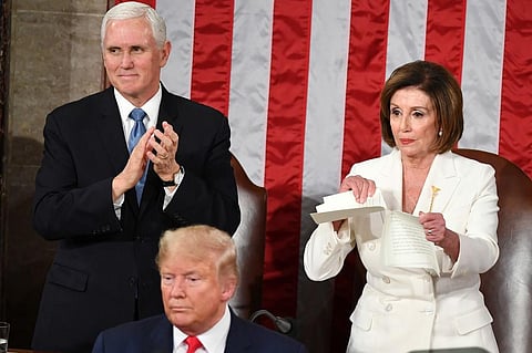 Speaker of the US House of Representatives Nancy Pelosi rips a copy of US President Donald Trumps speech after he delivered the State of the Union address at the US Capitol in Washington, DC, on February 4, 2020. (Photo | AFP)