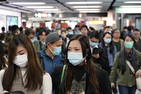 Passengers wear masks to prevent an outbreak of a new coronavirus in a subway station, in Hong Kong. (Photo | AP)