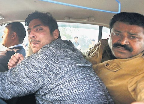 Police take away Kapil Gujjar of Dallupura, who opened fire at Shaheen Bagh area of New Delhi on Saturday. (Photo | Shekhar Yadav, EPS)