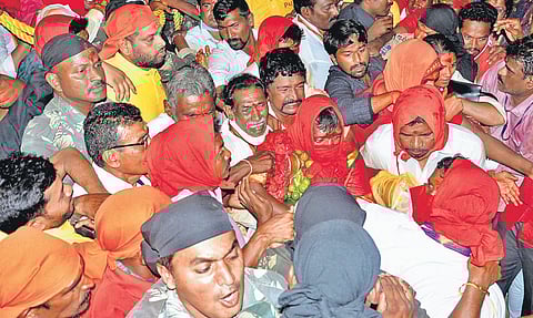 Priests carry the idol of tribal goddess Sarakka from Kannepalli to Medaram in Mulugu district on Wednesday