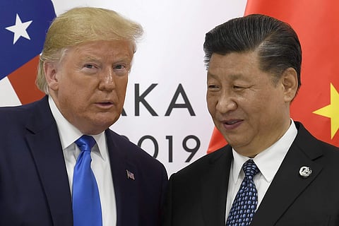 U.S. President Donald Trump poses for a photo with Chinese President Xi Jinping. (Photo | AP)