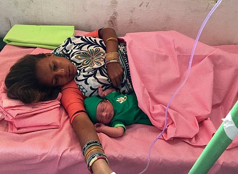 A woman from Maharashtra who came to offer prayers to Sammakka and Sarakka and she delivered a baby boy here on Thursday. (Photo| EPS)