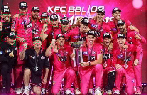 The victorious Sydney Sixers with the BBL trophy. (Twitter Photo)