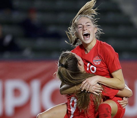 Canada forward Jordyn Huitema (9) celebrates her goal with teammate Janine Beckie during the CONCACAF women's Olympic qualifying match against Costa Rica. (Photo | AP)
