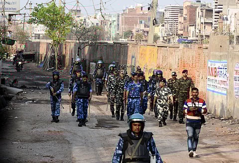 Security personnel on patrol at a northeast Delhi locality on Sunday.  (Photo | Parveen Negi, EPS)