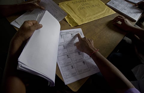 People check their names in the final list of the National Register of Citizens (NRC) at an NRC center. (Photo | AP)