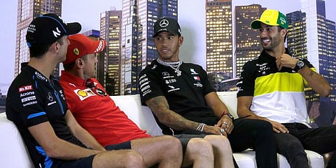Williams driver Nicholas Latifi of Canada, left, Ferrari driver Sebastian Vettel of Germany, secind left, Mercedes driver Lewis Hamilton of Britain and Renault driver Daniel Ricciardo of Australia, right, attend a press conference at the Australian Formul