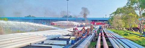 Fire personnel dousing a fire that broke out near the tank wagon gantry of the Bharat Petroleum Chemicals Pvt Ltd Refinery, at Irumpanam | Express