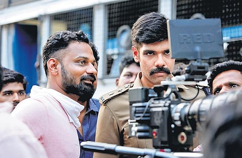 Director U Anbarasan (L) and Sibiraj on the sets of Walter.