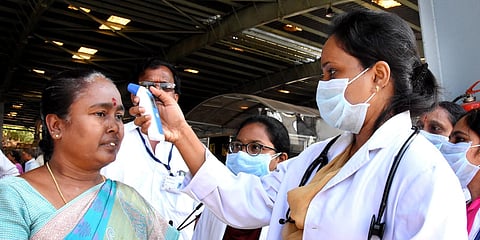 TTD health wing screening devotees with thermal scanners to identify the symptoms of COVID-19 at Alipiri check post in Tirupati. (Photo| Madhav K, EPS)