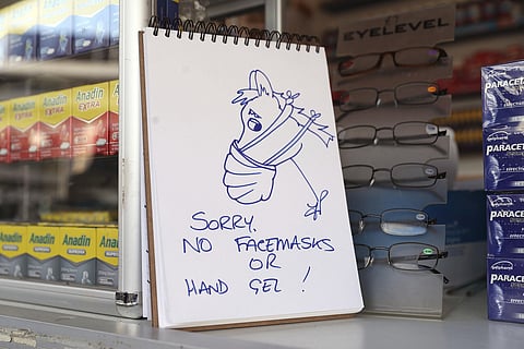 A stall displays a sign after running out of facemasks and antibacterial hand sanitiser due to the coronavirus outbreak during day three of the Cheltenham Festival at Cheltenham Racecourse, Cheltenham, England, Thursday, March 12, 2020. (Photo | AP)