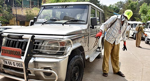 City Corporation worker spraying disinfectant to prevent the spreading of Coronavirus inside the collectorate premesis in Coimbatore. (Photo | U Rakesh Kumar, EPS)