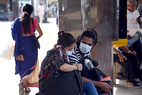 People wearing protective masks as precautionary measure for Coronavirus outbreak in Bengaluru on Sunday. (Photo | Nagaraja Gadekal P/EPS)