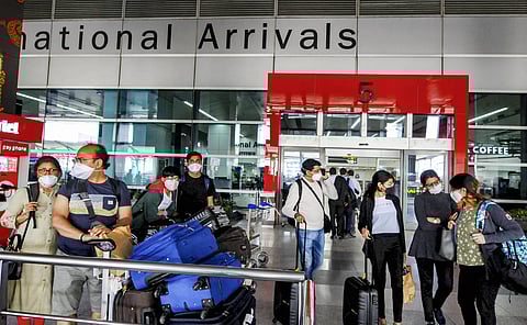 Passengers wear protective face masks in wake of novel coronavirus pandemic at Indira Gandhi International IGI Airport in New Delhi Sunday March 15 2020. (Photo | PTI)