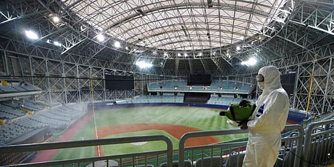 A worker wearing protective gears disinfects as a precaution against the new coronavirus at Gocheok Sky Dome in Seoul. (Photo | AP)