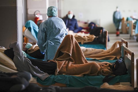 Patients lie on beds at one of the emergency structures that were set up to ease procedures at the Brescia hospital, Italy, Monday, March 16, 2020. (Photo | AP)