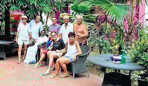 Parol Zbignle (extreme left) with his friends in Kovalam | Express
