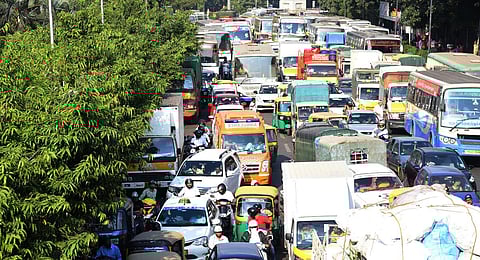 Ambulance stuck in traffic at KG Road in Bengaluru. (Photo | Vinod Kumar T, EPS)