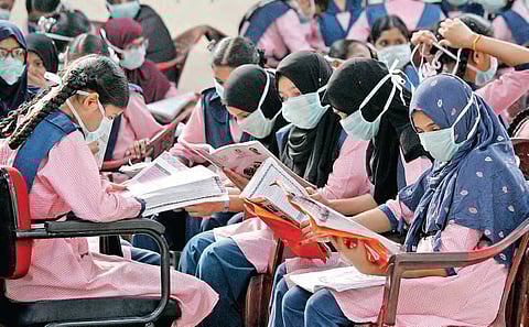 SSC students of Telangana Minority Residential School wearing masks prepare for the examinations at Bagh Lingampally in Hyderabad. (Photo | B Vani, EPS)