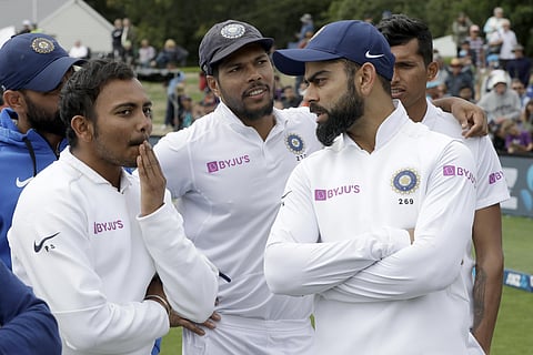 India's Virat Kohli, right, talks with his teammates. (Photo | AP)