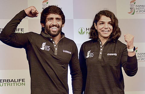 Indian wrestlers Bajrang Punia L and Sakshi Malik during a promotional event in Bengaluru. (Photo | PTI)