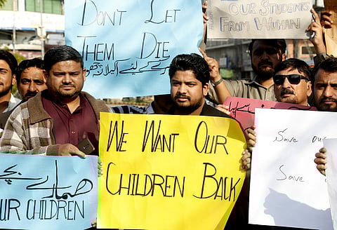 Family members of Pakistani students studying in Wuhan, China, hold a demonstration calling for the evacuation of their relatives after the Chinese city was badly hit by the coronavirus, in Lahore Pakistan, Sunday, March 1, 2020. (Photo | AP)