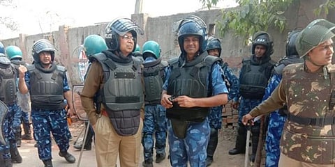 RAF officer Ashok Kumar (in blue uniform) at Shiv Vihar. (Photo | ANI)