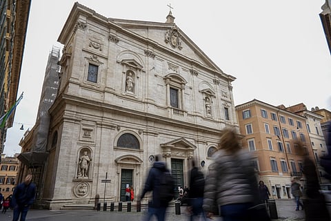 People walk past the St. Louis of the French church in Rome, Sunday, March 1, 2020. (Photo | AP)