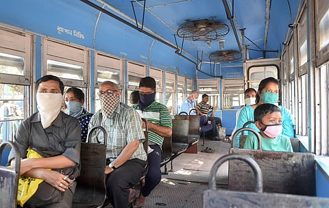 Commuters wearing maks as measures to mitigate the spread of coronavirus travel in a tram in Kolkata Friday March 20 2020. (Photo | PTI)