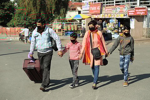 Family wearing masks as a preventive measure against the coronavirus outbreak. (Photo | PTI)