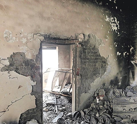 A shop in northeast Delhi, which was set on fire by a mob during the Delhi riots | express file