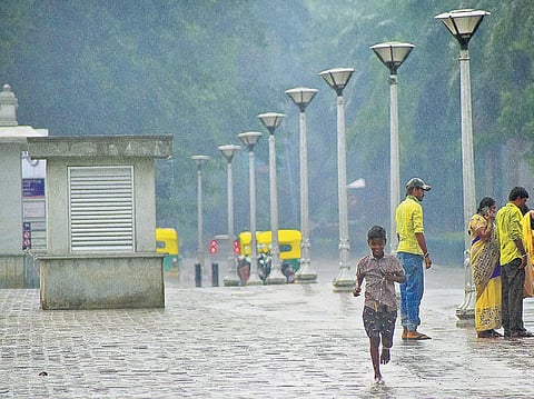 Citizens welcome pre-monsoon showers on Friday which have come as a respite with the mercury levels rising in Bengaluru | pandarinath B