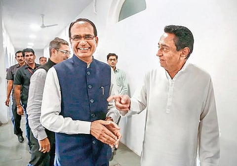 Shivraj Singh Chouhan with Kamal Nath at his residence in Bhopal.  (Photo | PTI )