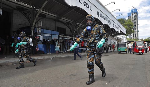 Sri Lankan government soldiers in protective clothes spray disinfectants at a railway station in Colombo, Sri Lanka, Wednesday, March 18, 2020. (Photo | AP)
