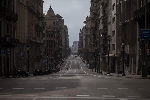 A view of Via Laietana street as authorities control public movements in Barcelona, Spain, Sunday, March 22, 2020. (Photo | AP)