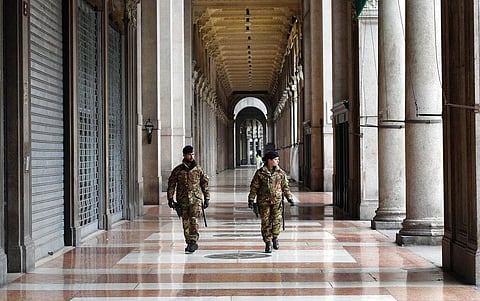 Italian soldiers patrol downtown Milan, Italy. (Photo | AP)