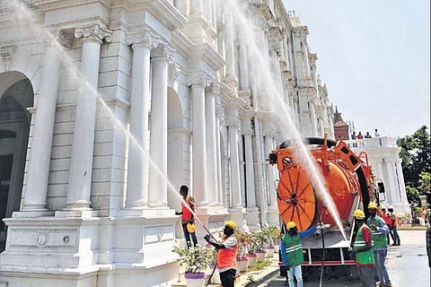 Chennai Corporation has deployed 15 sprayer trucks to disinfect several buildings in the city. Picture taken at Rippon Building on Saturday | DEBADATTA MALLICK
