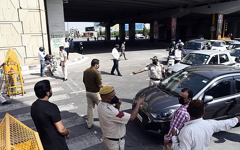 Police trying to stop people to enter in Delhi at Delhi-Ghaziabad border at NH24 area during the lockdown in Delhi on Monday. (Photo | Parveen Negi/EPS)