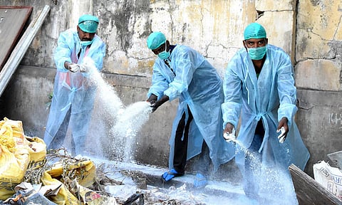 Municipality workers spraying disinfectant in Tirupati on Tuesday. (Photo | Madhav K, EPS)