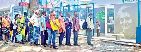People line up outside the Indira Canteen at Majestic for free meals  on Tuesday morning, in Bengaluru | pandarinath b
