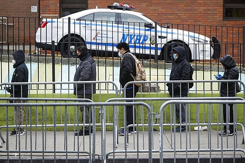 Patients maintain social distancing while they wait in line for a COVID-19 test at Elmhurst Hospital Center, Wednesday, March 25, 2020, in New York. (Photo | AP)
