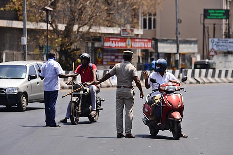 Police personnel checking motorists as the state witness first day of lockdown at Chennai. (Photo | Debadatta Mallick, EPS)