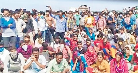 Students stage a protest demanding that they be allowed into AP at Pungudala bridge in Krishna dist on Thursday