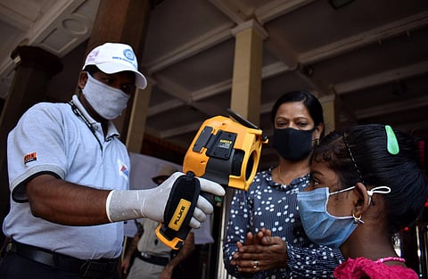 Passengers are screened for body temperature as a precautionary measure against COVID-19 at Secunderabad Railway Station in Hyderabad.(Photo | Express/S Senbagapandiyan)