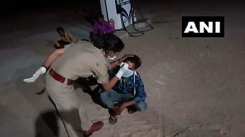 SI Amita Agnihotri was seen writing on the man's forehead. (Photo| ANI)