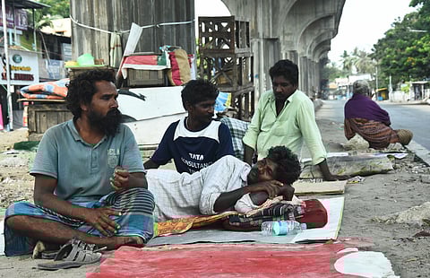 Saravanan and his friends from Villupuram who came to work in the construction site at Chennai now survining under a flyover at velachery with no way of returning back to his home town since the lockdown. (Photo | Ashwin Prasath/EPS)