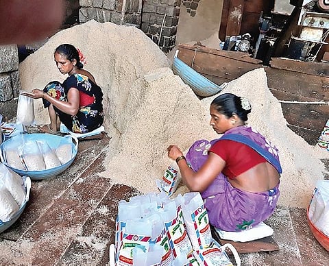 Labourers packing salt