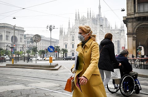 A woman wears a sanitary mask in downtown Milan, Italy, Tuesday, Feb. 25, 2020. (Photo | AP)