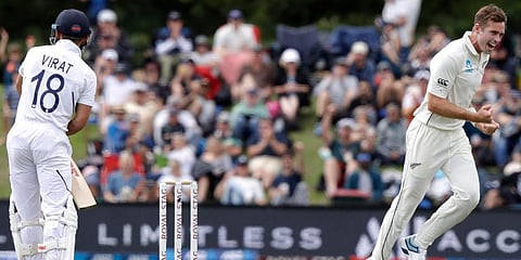 New Zealand's Tim Southee, right, celebrates after dismissing India's Virat Kohli, left, during play on day one of the second cricket test between New Zealand and India at Hagley Oval in Christchurch. (Photo | AP)